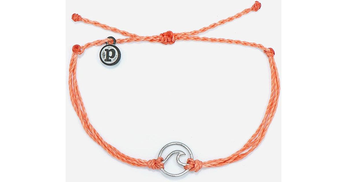 Ride the wave in style with our new Wave Charms! This bracelet features three colored strings and a cutout wave charm that looks totally rad worn solo or in a stack